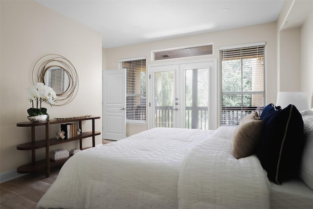 3406 Menchaca Rd Unit 14, Austin, TX 78704 - bedroom featuring access to outside, french doors, and wood finished floors