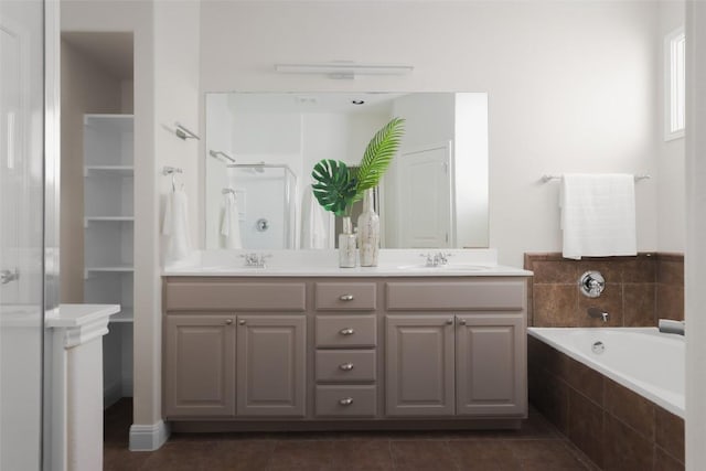 3406 Menchaca Rd Unit 14, Austin, TX 78704 - bathroom featuring double vanity, a stall shower, a garden tub, and tile patterned floors