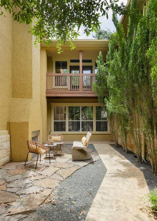 3406 Menchaca Rd Unit 14, Austin, TX 78704 - back of house featuring a balcony, a patio, and stucco siding