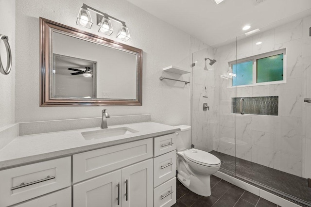 7604 Beinville Cv, Austin, TX 78749 - full bath featuring a marble finish shower, vanity, a ceiling fan, tile patterned flooring, and recessed lighting