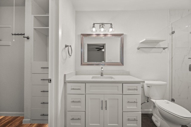 7604 Beinville Cv, Austin, TX 78749 - full bath featuring vanity, a shower stall, and wood finished floors