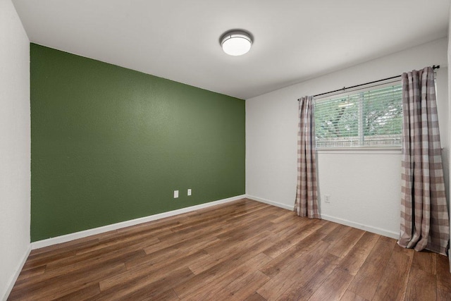 7604 Beinville Cv, Austin, TX 78749 - unfurnished room featuring wood finished floors and baseboards