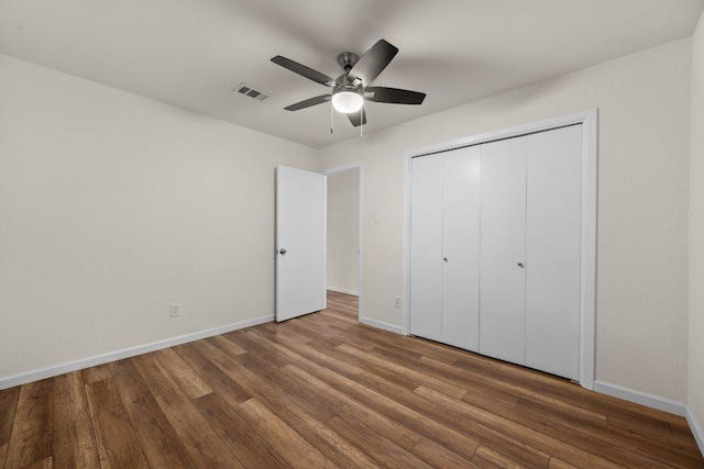 7604 Beinville Cv, Austin, TX 78749 - unfurnished bedroom with wood finished floors, a closet, and a ceiling fan