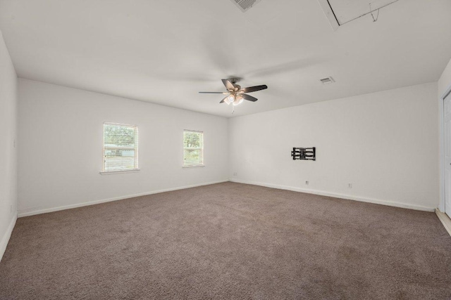 7604 Beinville Cv, Austin, TX 78749 - empty room featuring attic access, carpet floors, and a ceiling fan