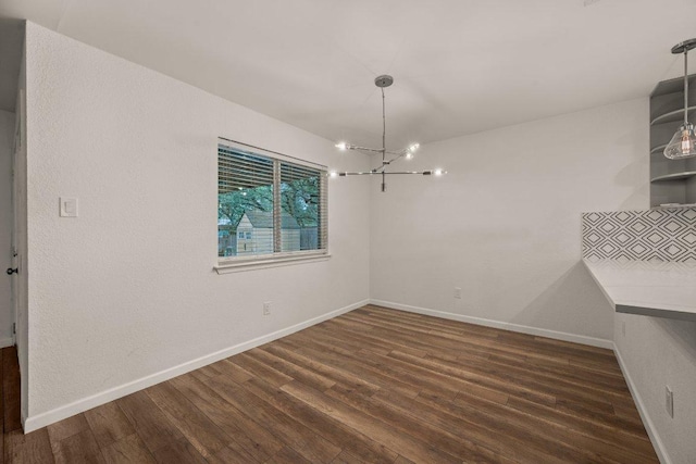 7604 Beinville Cv, Austin, TX 78749 - unfurnished dining area featuring a chandelier and wood finished floors
