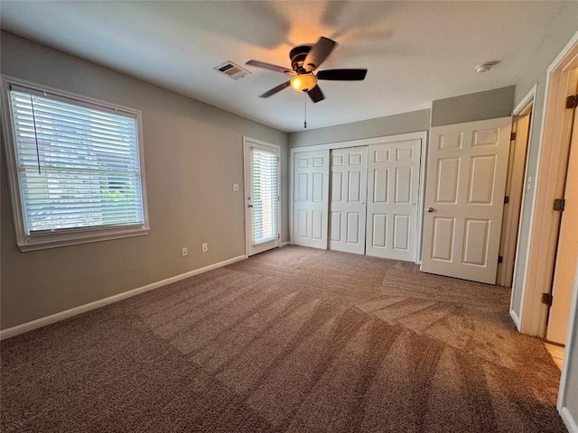6900 E Riverside Dr Unit 8, Austin, TX 78741 - unfurnished bedroom with carpet flooring, ceiling fan, and a closet