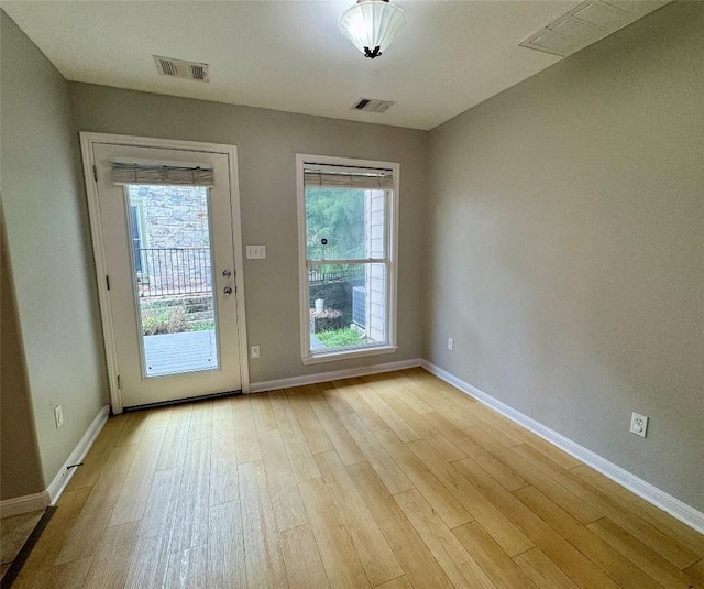 6900 E Riverside Dr Unit 8, Austin, TX 78741 - entryway with healthy amount of natural light and light wood-type flooring