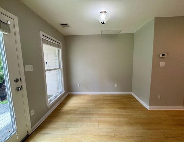 6900 E Riverside Dr Unit 8, Austin, TX 78741 - unfurnished dining area featuring healthy amount of natural light and light wood-style floors
