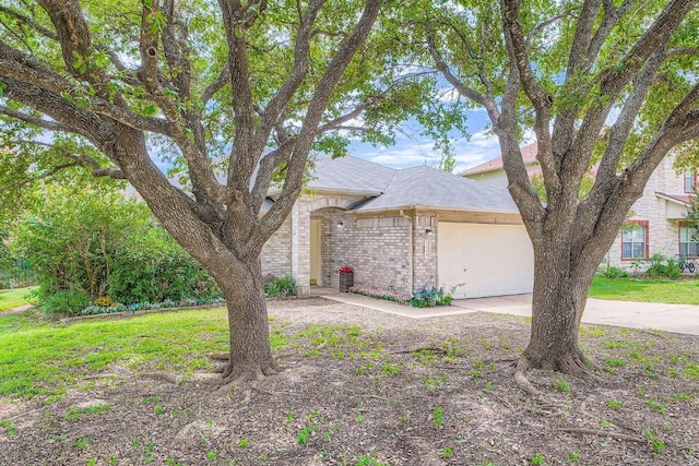 1506 Willow Bluff Dr, Pflugerville, TX 78660 - view of front of property with a garage, driveway, brick siding, and a shingled roof