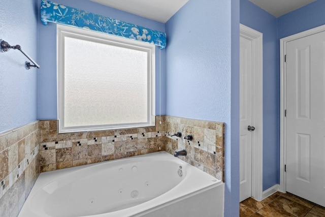 9105 Trickle Trace Trl, Round Rock, TX 78681 - bathroom featuring a tub with jets