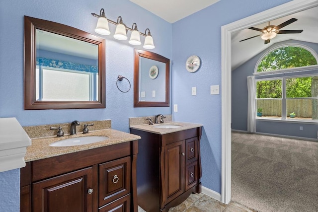 9105 Trickle Trace Trl, Round Rock, TX 78681 - full bathroom with lofted ceiling, two vanities, and ceiling fan