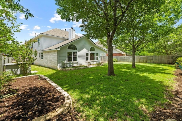 9105 Trickle Trace Trl, Round Rock, TX 78681 - back of property with a chimney, brick siding, and a fenced backyard