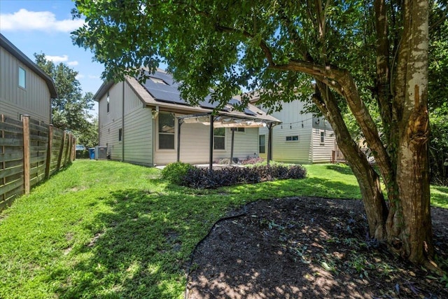 2101 Rivers Edge Way Unit 17, Austin, TX 78741 - back of property featuring roof mounted solar panels and a patio area