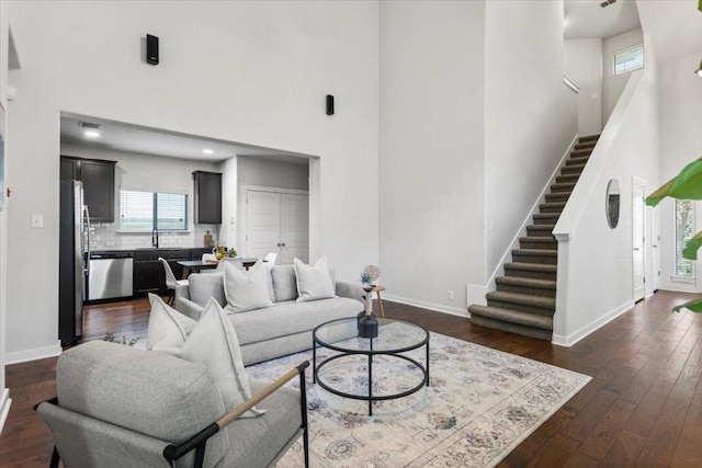 2101 Rivers Edge Way Unit 17, Austin, TX 78741 - living room featuring stairway, a high ceiling, and dark wood-style flooring