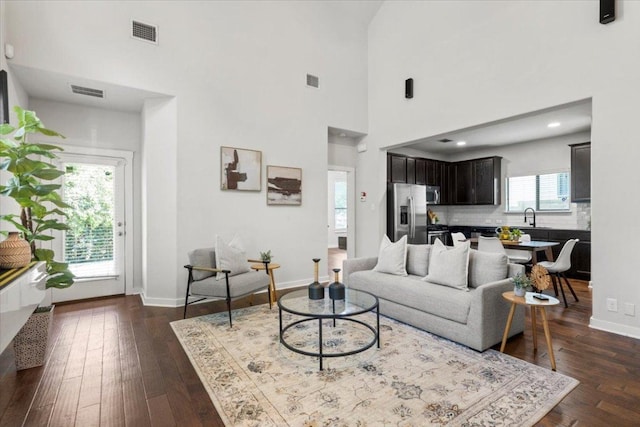 2101 Rivers Edge Way Unit 17, Austin, TX 78741 - living room featuring dark wood-style flooring and a high ceiling