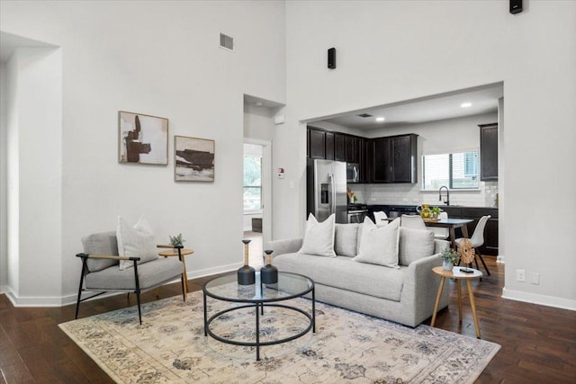2101 Rivers Edge Way Unit 17, Austin, TX 78741 - living area featuring dark wood finished floors, recessed lighting, and a high ceiling