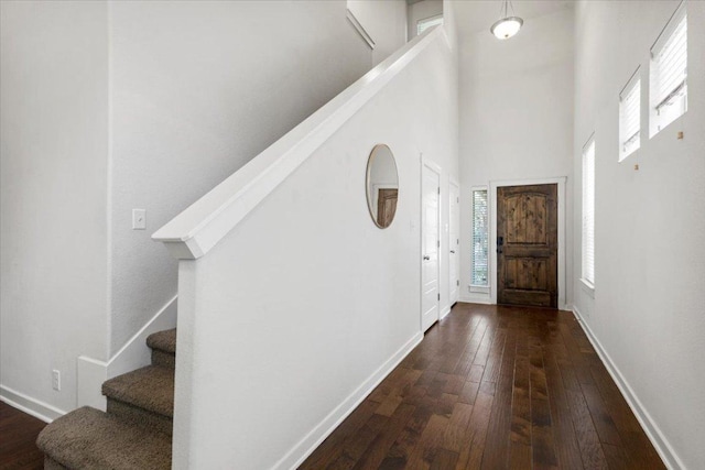 2101 Rivers Edge Way Unit 17, Austin, TX 78741 - entrance foyer featuring a towering ceiling, stairway, and dark wood-style flooring