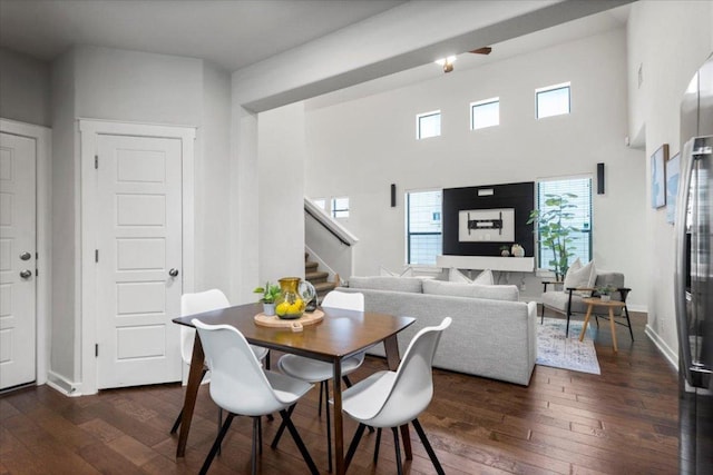 2101 Rivers Edge Way Unit 17, Austin, TX 78741 - dining room featuring stairs, dark wood-type flooring, and a high ceiling