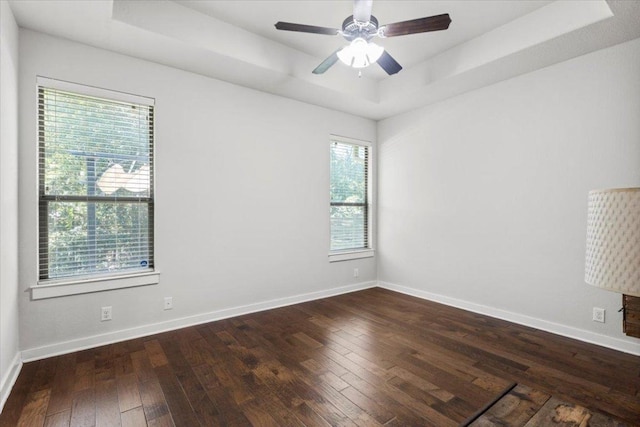 2101 Rivers Edge Way Unit 17, Austin, TX 78741 - unfurnished room with a raised ceiling, dark wood-style flooring, and a ceiling fan
