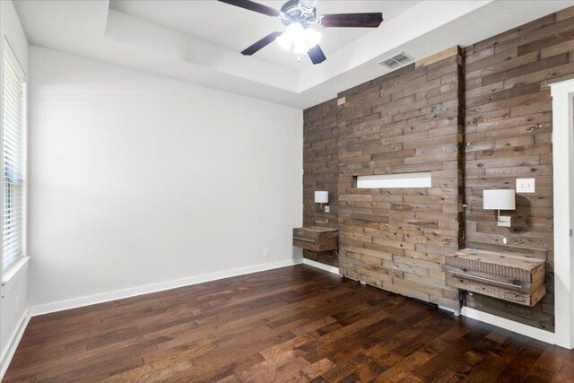 2101 Rivers Edge Way Unit 17, Austin, TX 78741 - empty room featuring a raised ceiling, wood finished floors, and ceiling fan