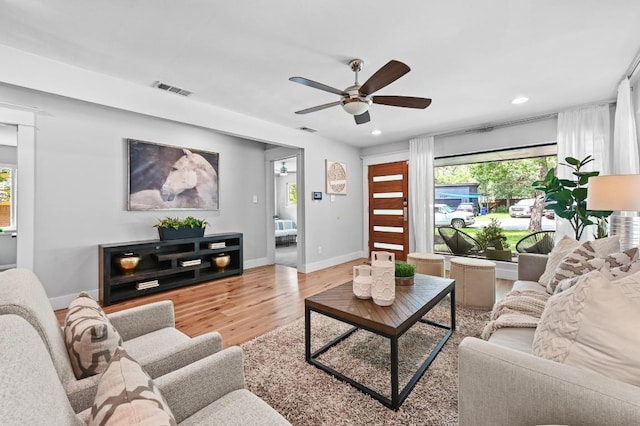 2306 Westoak Dr, Austin, TX 78704 - living area with a ceiling fan, wood finished floors, and recessed lighting