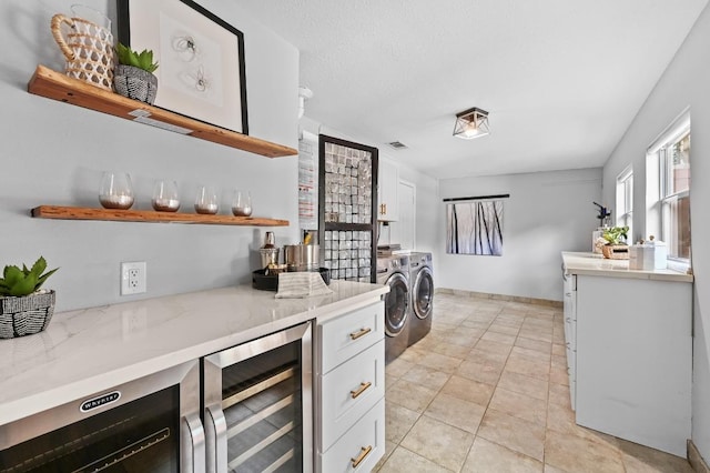 2306 Westoak Dr, Austin, TX 78704 - indoor dry bar featuring wine cooler and independent washer and dryer