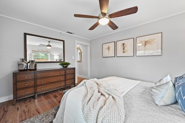 2306 Westoak Dr, Austin, TX 78704 - bedroom featuring wood finished floors, ornamental molding, and ceiling fan