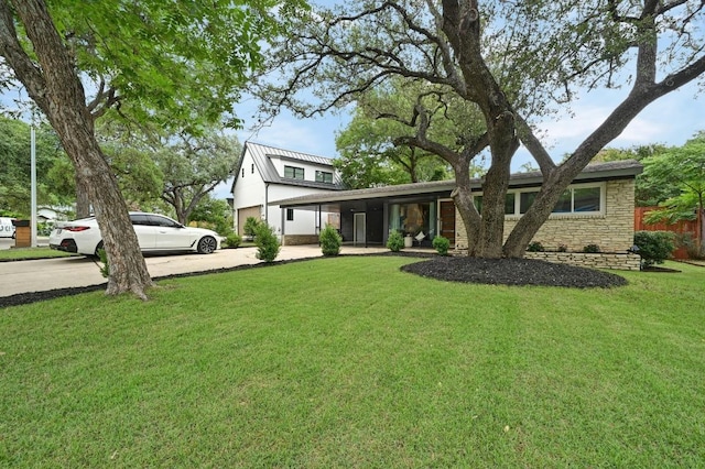 2306 Westoak Dr, Austin, TX 78704 - view of front of property featuring driveway and stone siding