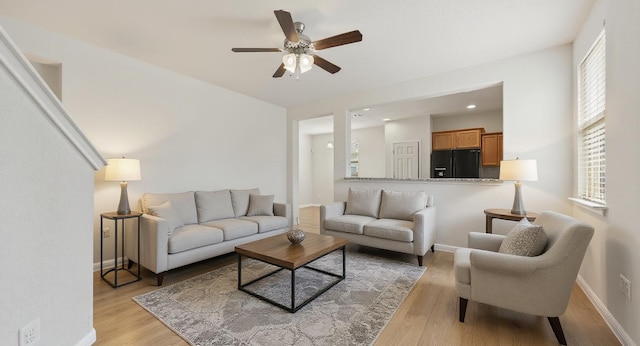 5809 Needle Nook Ct, Austin, TX 78744 - living area featuring light wood-style floors, ceiling fan, and recessed lighting