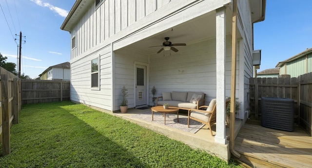 5809 Needle Nook Ct, Austin, TX 78744 - back of property with ceiling fan, a fenced backyard, an outdoor hangout area, board and batten siding, and a wooden deck