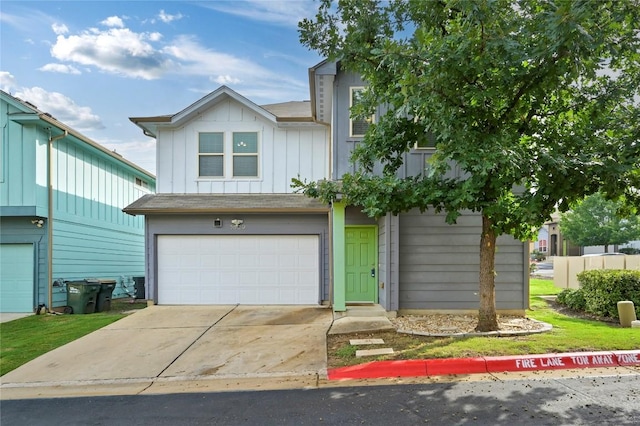 5809 Needle Nook Ct, Austin, TX 78744 - view of front facade featuring a garage, board and batten siding, and driveway