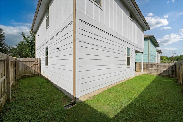 5809 Needle Nook Ct, Austin, TX 78744 - view of side of home featuring a fenced backyard and board and batten siding