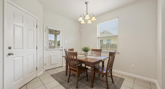 5809 Needle Nook Ct, Austin, TX 78744 - dining space with a chandelier and light tile patterned flooring