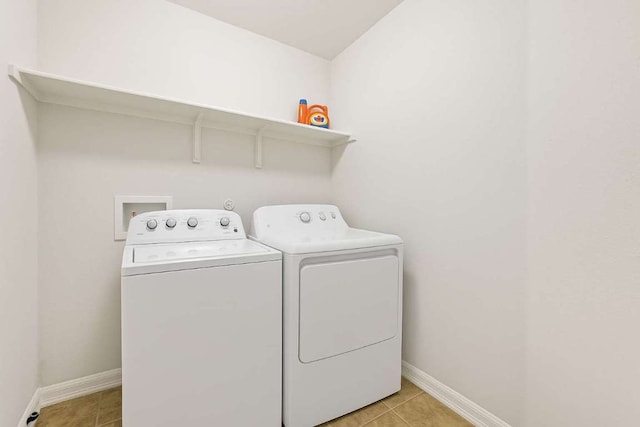 5809 Needle Nook Ct, Austin, TX 78744 - washroom with separate washer and dryer and light tile patterned floors