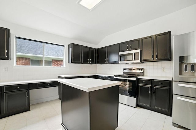 3013 Wavecrest Blvd, Austin, TX 78728 - kitchen featuring stainless steel appliances, lofted ceiling, light countertops, light tile patterned flooring, and decorative backsplash