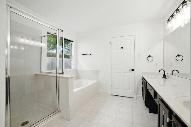 3013 Wavecrest Blvd, Austin, TX 78728 - bathroom featuring a garden tub, double vanity, a shower stall, and tile patterned floors