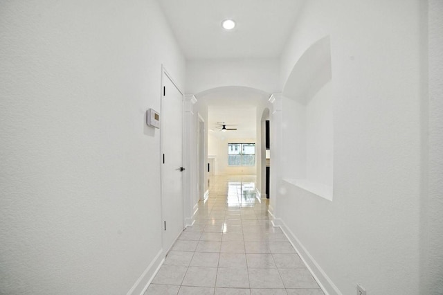 3013 Wavecrest Blvd, Austin, TX 78728 - hall featuring arched walkways, light tile patterned flooring, and recessed lighting