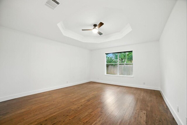 3013 Wavecrest Blvd, Austin, TX 78728 - unfurnished room with a raised ceiling, a ceiling fan, dark wood-type flooring, ornamental molding, and a skylight