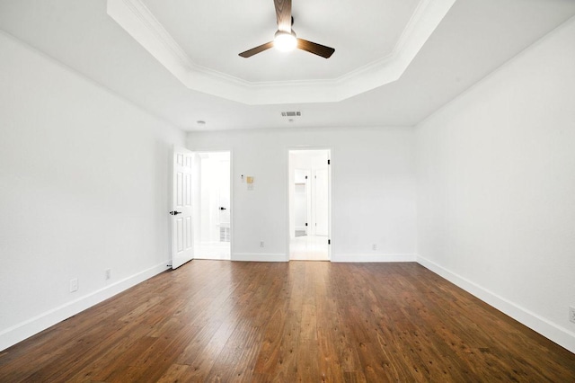 3013 Wavecrest Blvd, Austin, TX 78728 - spare room featuring a tray ceiling, a ceiling fan, dark wood-style flooring, and ornamental molding