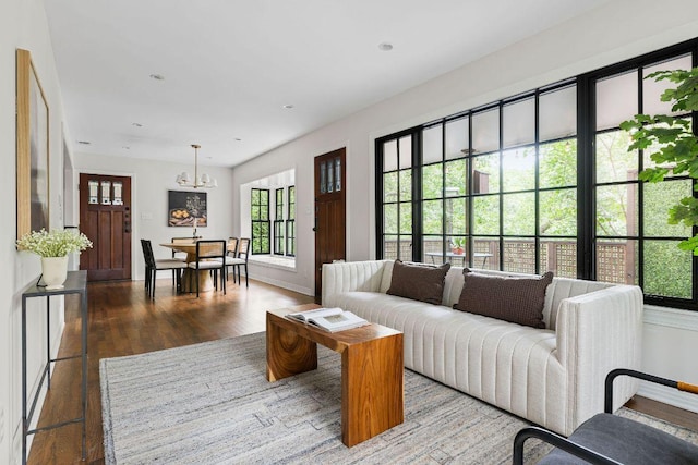 1118 Reagan Ter, Austin, TX 78704 - living area with a chandelier and wood finished floors
