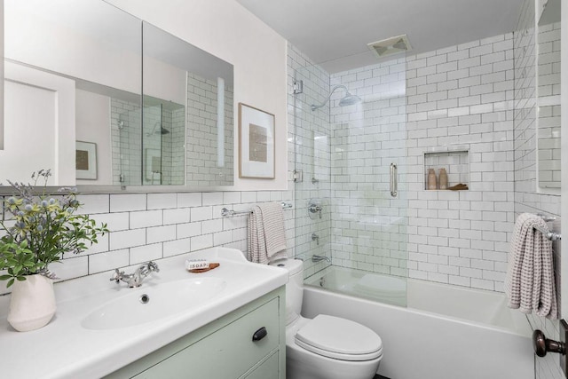 1118 Reagan Ter, Austin, TX 78704 - full bath with vanity, tile walls, and bath / shower combo with glass door