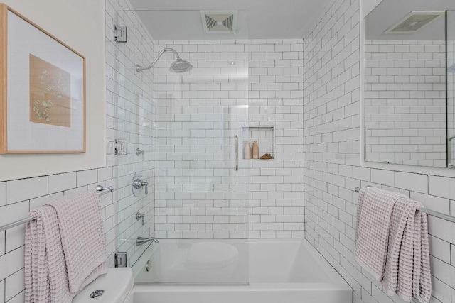 1118 Reagan Ter, Austin, TX 78704 - bathroom with tile walls and combined bath / shower with glass door