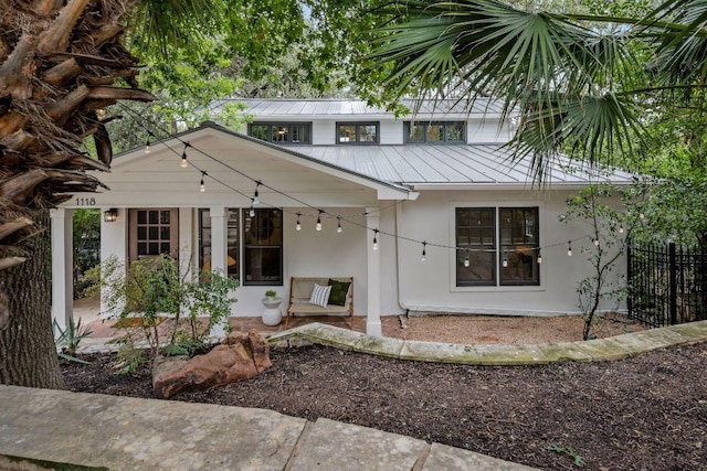 1118 Reagan Ter, Austin, TX 78704 - view of front of house with stucco siding and a metal roof