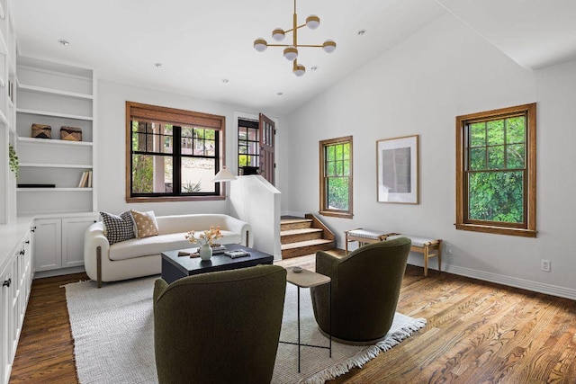 1118 Reagan Ter, Austin, TX 78704 - living room featuring wood finished floors, a chandelier, vaulted ceiling, and built in features