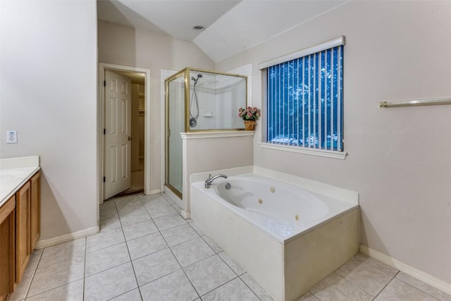 601 Indian Run Dr, Pflugerville, TX 78660 - bathroom with a stall shower, lofted ceiling, a whirlpool tub, tile patterned floors, and vanity