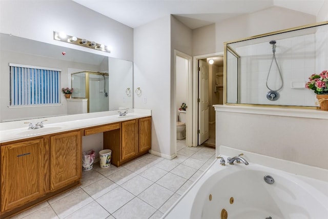 601 Indian Run Dr, Pflugerville, TX 78660 - full bath featuring a stall shower, tile patterned floors, double vanity, and a whirlpool tub