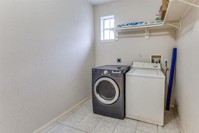 601 Indian Run Dr, Pflugerville, TX 78660 - laundry room with separate washer and dryer and light tile patterned floors