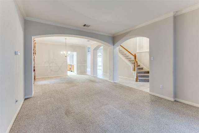 601 Indian Run Dr, Pflugerville, TX 78660 - unfurnished room featuring carpet, ornamental molding, stairs, arched walkways, and a chandelier