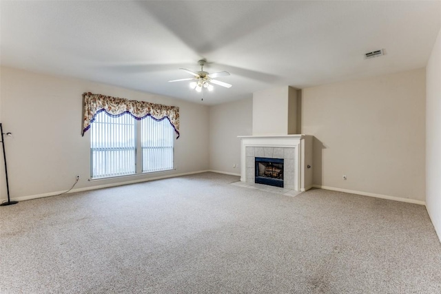 601 Indian Run Dr, Pflugerville, TX 78660 - unfurnished living room with carpet, ceiling fan, and a fireplace