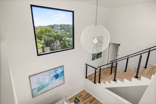 3704 Laurel Ledge Ln, Austin, TX 78731 - stairway featuring plenty of natural light and wood finished floors